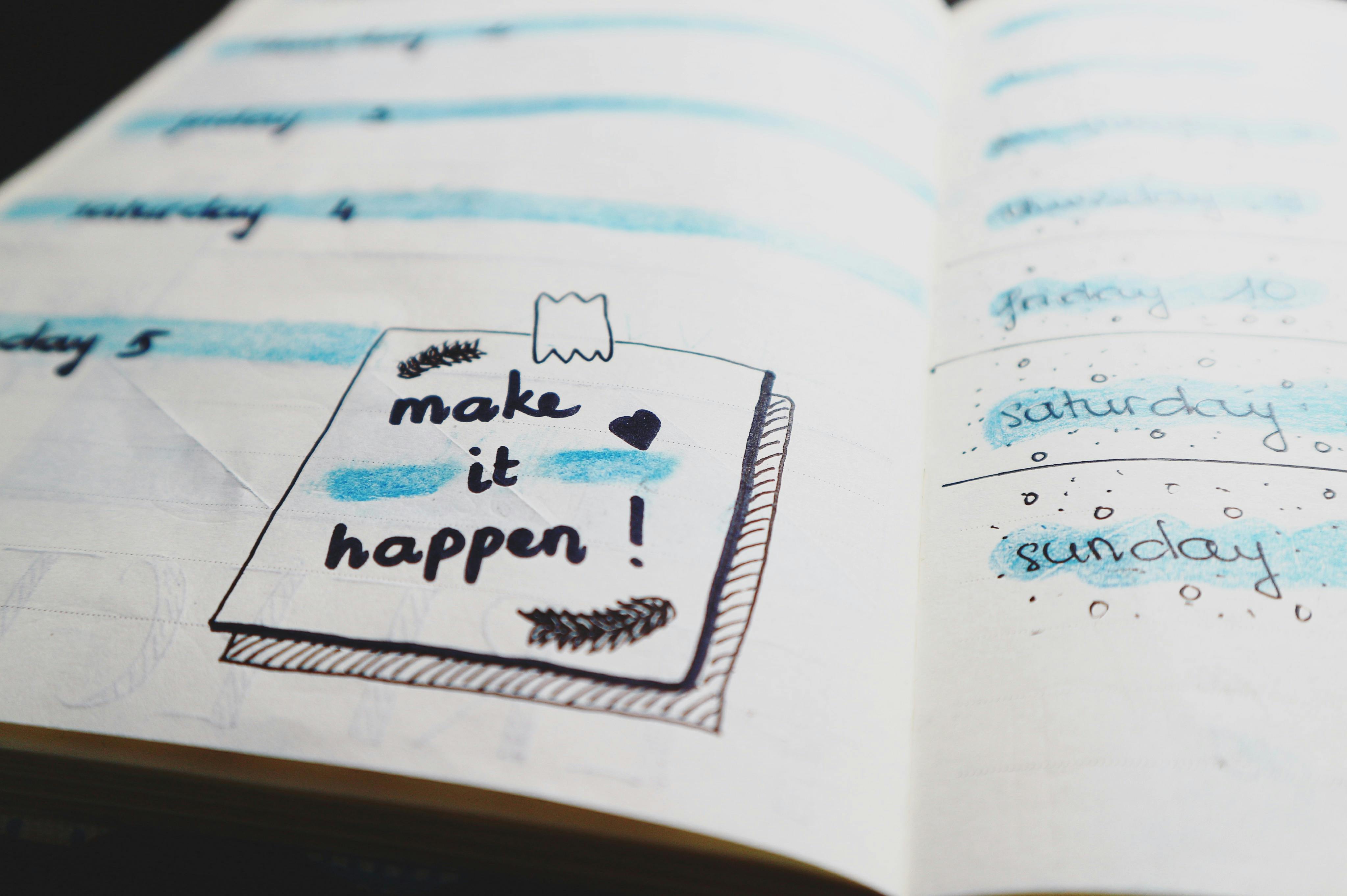 A picture of a planning notepad with a box saying 'make it happen'